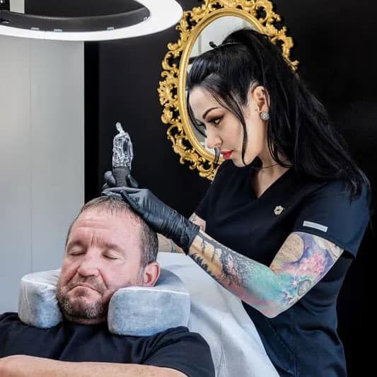Tara Rebel performing scalp micropigmentation